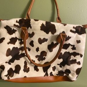 Cow hide bag. Good to use for overnight stay.